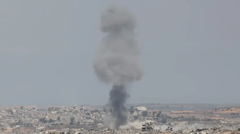 epa12294748 Smoke rises from destroyed buildings following an Israeli airstrike inside Gaza, as seen from the Israeli side, near the border with Gaza Strip, in southern Israel, 12 August 2025. Over 61,400 Palestinians have been killed in the Gaza Strip since October 2023, according to the Palestinian Ministry of Health, and about 1,200 Israelis have been killed since the launch of an Israeli military campaign in response to a cross-border attack by Hamas on 07 October 2023 EPA/ABIR SULTAN