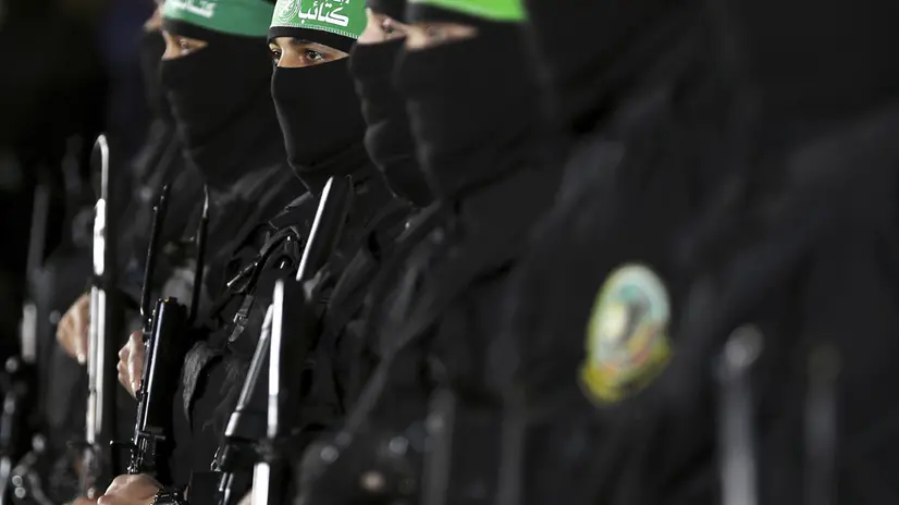 epaselect epa05874424 Fighters from the Ezz-Al Din Al Qassam Brigades, the armed wing of the Palestinian Hamas movement, attend the memorial service for Mazen Faqhaa, senior leader of Ezz-Al Din Al Qassam Brigades, the armed wing of the Palestinian Hamas movement, in Gaza City, Gaza Strip, 27 March 2017. Mazen Faqhaa was killed on 24 March 2017 after gunmen shot dead him near his home in the Tal Al-Hawa neighborhood of Gaza City. Faqhaa was freed by Israeli in 2011 prisoner swap with more than 1,000 other Palestinian prisoners in exchange for Gilad Shalit, an Israeli soldier Hamas had detained for five years. Hamas officials have said the killing bears the hallmarks of Israel's intelligence service Mossad, but Israel has not commented on the shooting. EPA/MOHAMMED SABER