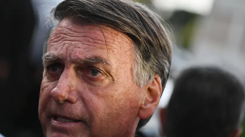 epa12158874 Brazil's former president Jair Bolsonaro talks to the press as he leaves after testifying, at the Federal Police facilities, about his son Eduardo's actions in the United States, in Brasilia, Brazil, 05 June 2025. EPA/Andre Borges