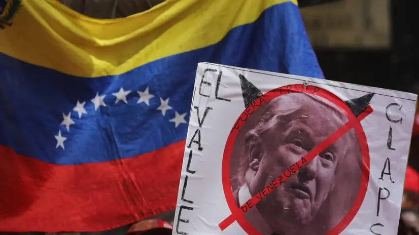epa07532871 A view of a sign with the face of US President Donald J. Trump and a sign that reads 'Out of Venezuela' during a rally led by Venezuelan President Nicolas Maduro to celebrate the withdrawal of the country from the Organization of American States (OAS), in Caracas, Venezuela, 27 April 2019. EPA/Miguel Gutierrez