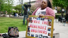 epa12037138 Evonna McIntosh holds a poster outside of the Menendez brothers resentencing hearing in Los Angeles, California, USA, 17 April 2025. Brothers Lyle and Erik Menendez were sentenced in 1996 for first degree murder for killing their parents, Jose and Kitty Menendez, but new evidence in the case has led prosecutors to reexamine the brothers' sentencing. EPA/CAROLINE BREHMAN