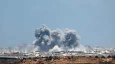 epa12274530 Smoke rises following an Israeli airstrike in the northern Gaza Strip, as seen from the Israeli side of the border, 31 July 2025. EPA/ATEF SAFADI