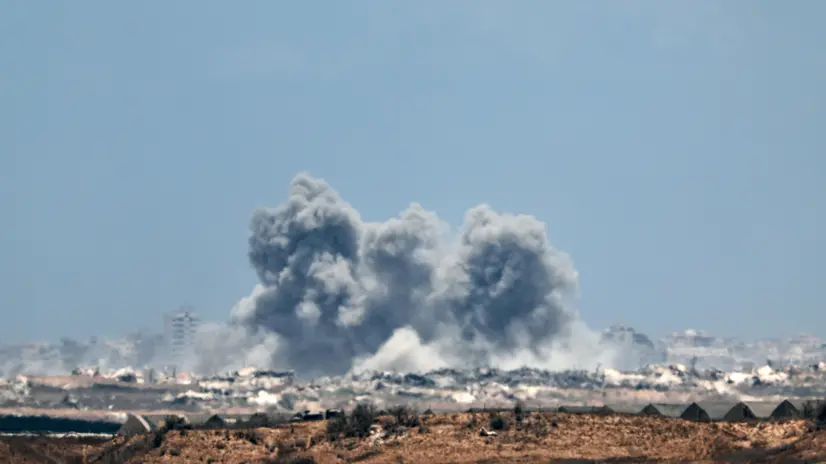 epa12274530 Smoke rises following an Israeli airstrike in the northern Gaza Strip, as seen from the Israeli side of the border, 31 July 2025. EPA/ATEF SAFADI