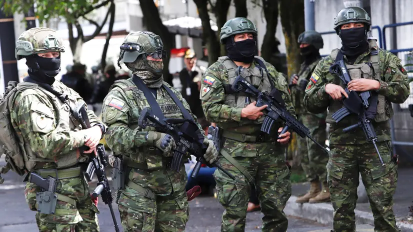 epa12295990 Members of the Ecuadorian special forces guard the headquarters of the Constitutional Court prior to a demonstration in Quito, Ecuador, 12 August 2025. The Ecuadorian president called for a mobilization against the Constitutional Court to protest the provisional suspension of a series of laws promoted by his government. EPA/GIANNA BENALCAZAR
