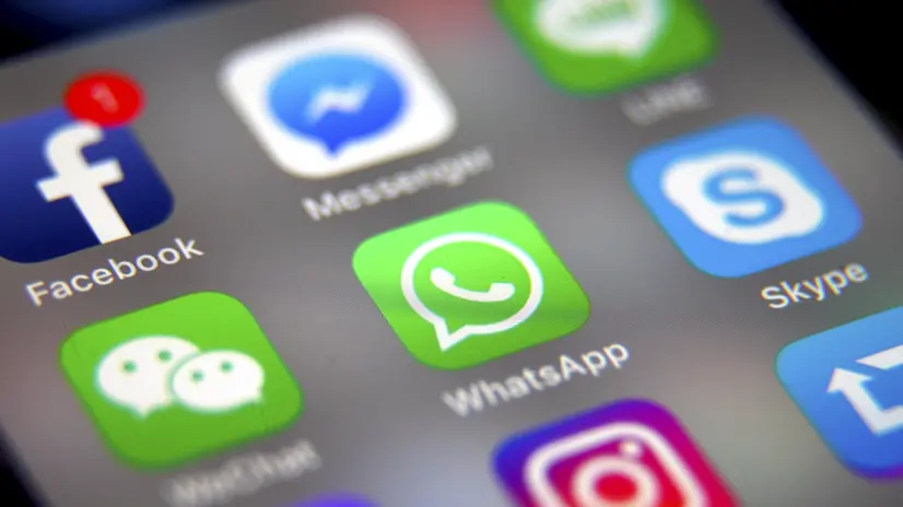 epa06398356 (FILE) - The logo of the messaging application WhatsApp (C) is pictured on a smartphone screen with the Facebook (top L) app logo in Taipei, Taiwan, 26 September 2017 (reissued 19 December 2017). According to reports, the German cartel office on 19 December 2017 found that Facebook has abused its dominant market position. The preliminary findings suggest that Facebook's targeted advertising also uses third-party data collected from the social network's subisidiaries WhatsApp and Instagram. EPA/RITCHIE B. TONGO *** Local Caption *** 53792247