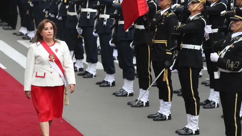 epa12269051 Peruvian President Dina Boluarte reviews the troops upon her arrival at Congress in Lima, Peru, 28 July 2025. Official activities for the 204th anniversary of Peruvian Independence Day began with a Mass in Lima Cathedral, while Boluarte is expected to deliver a speech to the full Congress, before participating on 29 July in the traditional civic-military parade on the central Avenida Brasil in the Peruvian capital. EPA/PAOLO AGUILAR