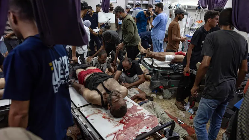 epa12284571 GRAPHIC CONTENT - Wounded Palestinians are treated at Nasser Hospital in Khan Younis, Gaza Strip, 05 August 2025. According to the hospital, hundreds of patients were being treated following Israeli bombardements on a near-by area. EPA/HAITHAM IMAD -- ATTENTION EDITORS: GRAPHIC CONTENT --