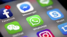 epa07568741 (FILE) - The logo of the messaging application WhatsApp (C) is pictured on a smartphone screen in Taipei, Taiwan, 26 September 2017 (reissued 14 May 2019). Facebook's messenger service WhatsApp has been the target of hackers, with remotely installed surveillance software developed Israeli security firm NSO Group, according to media reports. EPA/RITCHIE B. TONGO