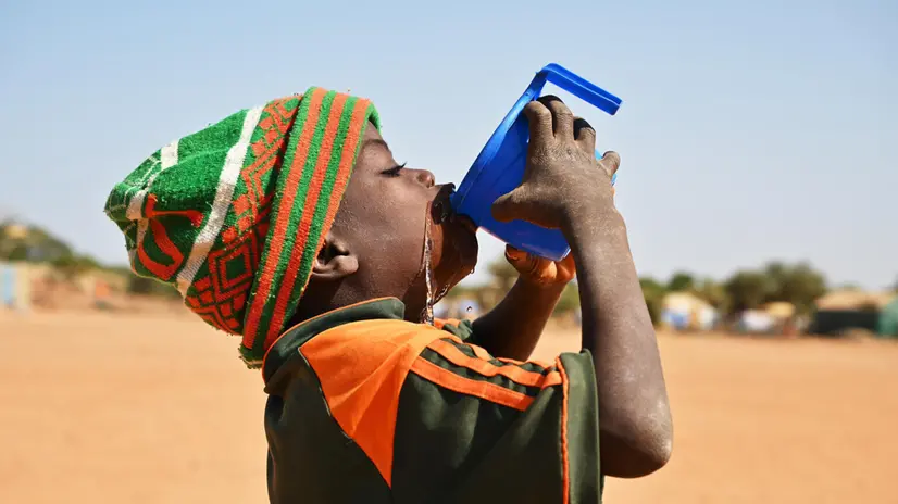 A boy is drinking water at the Child Friendly Space of Fada N’gourma, in the east of Burkina Faso. The child-friendly space (EAE) in sector 6 north of Fada was created in August 2023 and welcomes 1,633 children aged 3 to 17. It is led by the Yanyenma consortium made up of the Todima, Todi Yaba associations and the Association for the Development of Village Communities (ADCV) which provides leadership in partnership with UNICEF. In this EAE, a multisectoral integrated humanitarian assistance program is being implemented for the benefit of children and internally displaced people and the host population. Protection activities are associated with those of health-nutrition and education. For every child protection.
