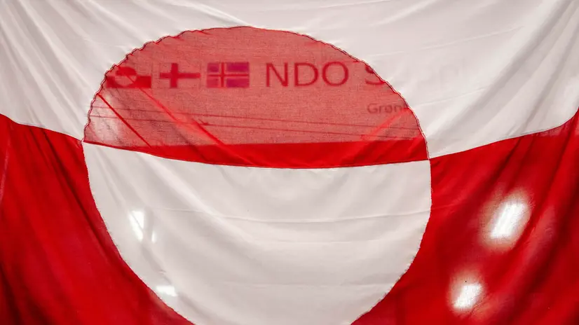 epa12003323 The Greenland flag is seen during the Greenlandic municipal councils, village councils, and parish elections at Godthaabshallen sports hall in Nuuk, Greenland, 01 April 2025. EPA/Mads Claus Rasmussen DENMARK OUT