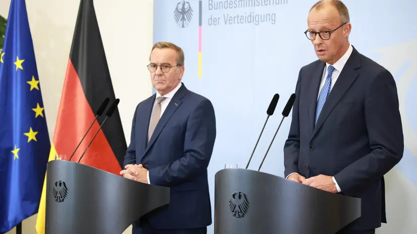 epa12325906 German Chancellor Friedrich Merz (R) speaks next to German Defense Minister Boris Pistorius during a press conference after a meeting of the German cabinet at the Defense Ministry in Berlin, Germany, 27 August 2025. The cabinet met over new legislation to raise the personnel count in the Bundeswehr, the German armed forces, by creating a voluntary military service. EPA/CLEMENS BILAN