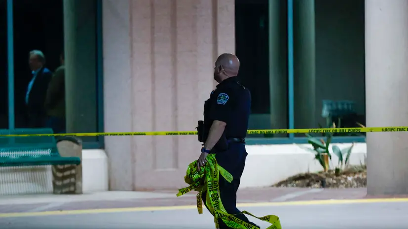 epa11151318 An Austin police officer carries 'Do Not Cross' tape where a car drove through the emergency room entrance, at St. Davidâ€™s North Austin Medical Center in Austin, Texas, USA, 13 February 2024. According to a statement from the medical center's chief medical officer, one person has died and at least five others on scene were injured when a vehicle collided with the emergency room department at St. Davidâ€™s North Austin Medical Center. EPA/Adam Davis