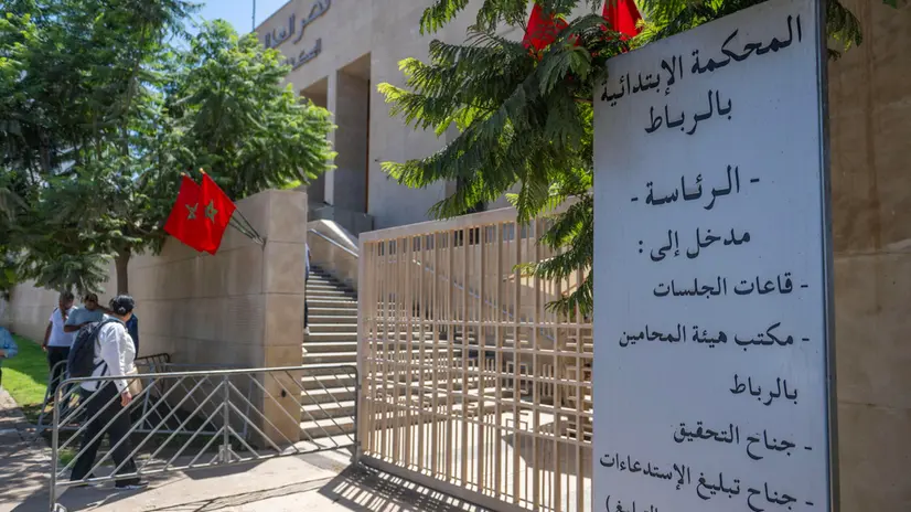 epa12326768 Journalists and activists gather at the entrance of the Rabat Court of First Instance during the trial of feminist activist Ibtissam Lachgar over a T-shirt deemed 'blasphemous,' in Rabat, Morocco, 27 August 2025. EPA/JALAL MORCHIDI
