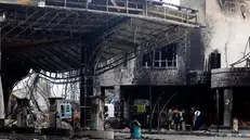 epa12321703 People inspect a destroyed gasoline station a day after Israeli airstrikes hit it in Sana'a, Yemen, 25 August 2025. At least six people were killed and 86 others injured, including 21 in critical condition, in Israeli airstrikes that targeted several sites in the Houthi-controlled capital Sana'a on 24 August, in response to Houthi missile attacks on Israel, the Ministry of Health reported. EPA/YAHYA ARHAB