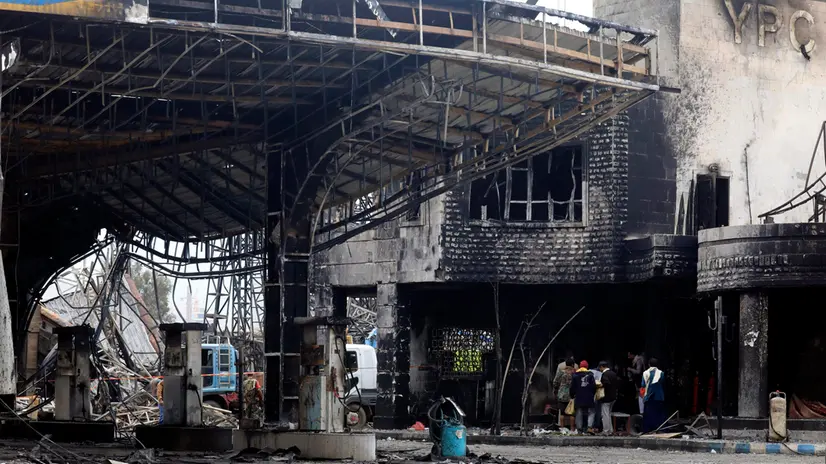 epa12321703 People inspect a destroyed gasoline station a day after Israeli airstrikes hit it in Sana'a, Yemen, 25 August 2025. At least six people were killed and 86 others injured, including 21 in critical condition, in Israeli airstrikes that targeted several sites in the Houthi-controlled capital Sana'a on 24 August, in response to Houthi missile attacks on Israel, the Ministry of Health reported. EPA/YAHYA ARHAB