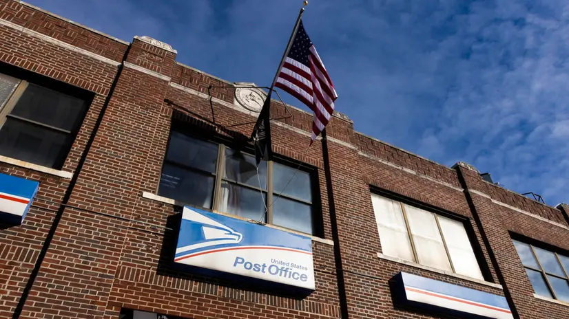 epa08892433 United States Postal Service office in the Brooklyn borough of New York, New York, USA, 18 December 2020. The postal service is facing a massive volume of packages and backlogs as people shop online at record levels and as private package delivery services start to limiting services to some e-commerce retailers, pushing more business to the USPS. EPA/JUSTIN LANE