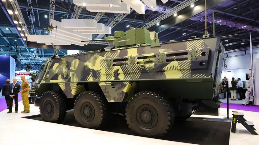 epa09471598 The Patria armoured wheeled vehicle on display during the Defence Security Equipment International (DSEI) exhibition at ExCel in London, Britain, 16 September 2021. The DSEI exhibition takes place from 14 to 17 September 2021 in London. EPA/VICKIE FLORES
