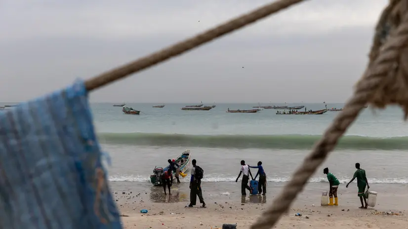 epa11846365 Fishermen prepare to go out at sea in Bargny, 30 kilometres west of Dakar, Senegal, 17 January 2025 (issued 23 January 2025). In October 2023 from this location, a pirogue with over 100 would-be migrants left Senegal for Spain in search of better opportunities and disappeared forever.'Nobody (of the more than a hundred who were travelling on the boat) has been recovered,' said local resident Binata Dieng, whose 19-year-old daughter was on board. According to figures from the European Border and Coast Guard Agency (Frontex), more than 87,000 people arrived in Spain via the Atlantic route in 2023 and 2024, coming not only from Senegal but also from countries such as Mauritania and Gambia. In Bargny, the local government estimates that nearly 3,000 people from the settlement have taken this migratory route in the last two years. Bargny symbolises one of the greatest tragedies of emigration and the intersection between environmental deterioration and socio-economic fragility in coastal cities in Senegal. EPA/JEROME FAVRE
