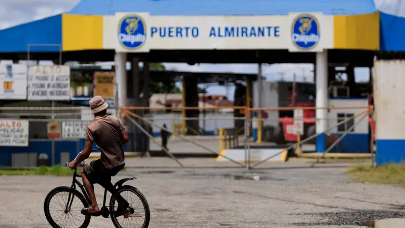 epa12179756 A person passes in front of the entrance of the Chiquita Panama company in Puerto Almirante, Panama, 16 June 2025. The special law that gives greater benefits and labor protections to banana workers in Panama came into force, after being published in the Official Gazette with the signature of Panamanian President, Jose Raul Mulino, while protests continue in the border areas with Costa Rica. EPA/Bienvenido Velasco