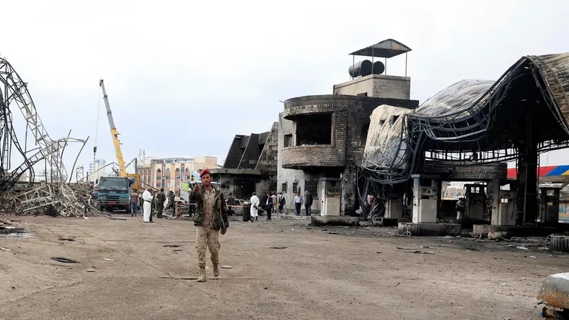 epa12321710 A Houthi soldier stands guard at a destroyed gasoline station a day after Israeli airstrikes hit it in Sana'a, Yemen, 25 August 2025. At least six people were killed and 86 others injured, including 21 in critical condition, in Israeli airstrikes that targeted several sites in the Houthi-controlled capital Sana'a on 24 August, in response to Houthi missile attacks on Israel, the Ministry of Health reported. EPA/YAHYA ARHAB