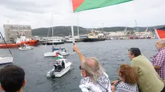 epa12336013 People attend a rally held to show support for the Flotilla Sumud Global to Palestine in the port of Ferrol, in northwestern Spain, 30 August 2025. Flotilla Sumud Global is to depart for Gaza from Barcelona on 31 August to try to open a humanitarian corridor. EPA/KIKO DELGADO