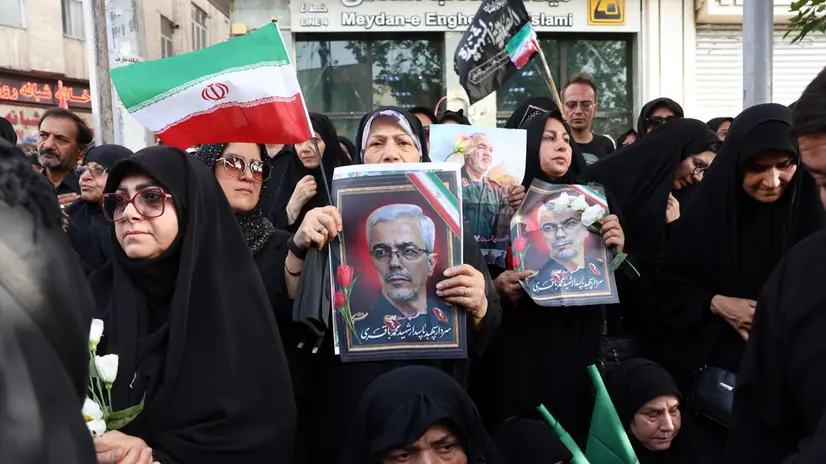 epa12202185 Iranian women hold posters of late Iranian Armed Forces Chief of Staff General Mohammad Bagheri during a funeral ceremony for Iranian IRGC generals and scientists who were killed in recent Israeli airstrikes, in Tehran, Iran, 28 June 2025. Israel has been conducting a campaign across Iran since 13 June, targeting nuclear, military, and energy facilities, prompting Iran to launch retaliatory waves of missiles and drones toward Israel. EPA/ABEDIN TAHERKENAREH