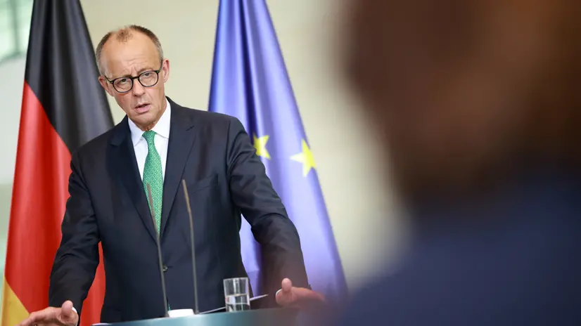 epa12345900 German Chancellor Friedrich Merz holds a joint press conference with the Swiss federal president at the Chancellery in Berlin, Germany, 02 September 2025. EPA/CLEMENS BILAN