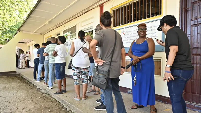 epa12350573 People line up to vote during the elections in Kingston, Jamaica, 03 September 2025. Nearly 2.1 million Jamaicans head to the polls to elect a new government in an election in which the Jamaica Labour Party (JLP) seeks a third consecutive term. EPA/Rudolph Brown