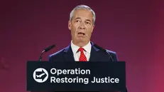 epa12323268 Nigel Farage, leader of Reform UK party and Member of Parliament, delivers a speech at the launch of Reform UK’s plan to deport asylum seekers if they get into government, in Oxford Airport in Kidlington, Britain, 26 August 2025. The Reform UK party is proposing to forcibly remove hundreds of thousands of people who came to the UK without permission. The plan is that they would be housed at military sites before being sent back to the places they fled on one of five daily deportation flights, or to fee-receiving third countries. EPA/TOLGA AKMEN