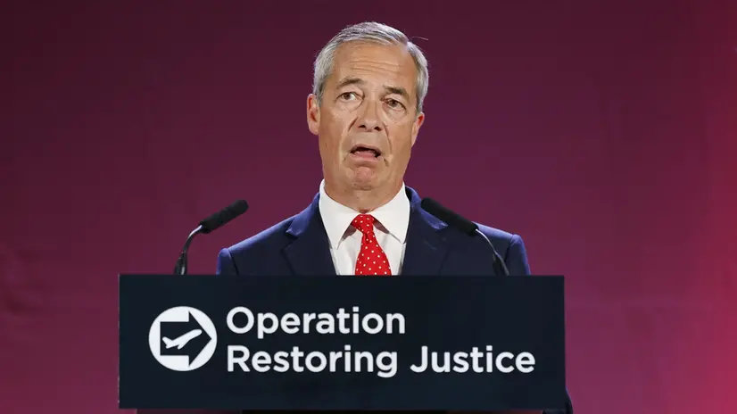 epa12323268 Nigel Farage, leader of Reform UK party and Member of Parliament, delivers a speech at the launch of Reform UK’s plan to deport asylum seekers if they get into government, in Oxford Airport in Kidlington, Britain, 26 August 2025. The Reform UK party is proposing to forcibly remove hundreds of thousands of people who came to the UK without permission. The plan is that they would be housed at military sites before being sent back to the places they fled on one of five daily deportation flights, or to fee-receiving third countries. EPA/TOLGA AKMEN