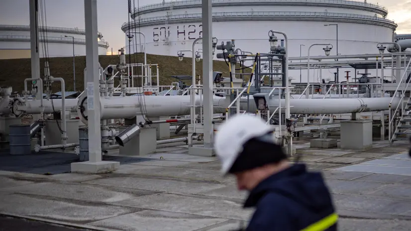 epa11824370 An employee walks past storage tanks and pipelines at the Central oil tank farm operated by Mero CR near Nelahozeves, Czech Republic, 14 January 2025. Mero CR, who owns and operates the Czech part of the Druzhba pipeline and the IKL pipeline, has completed technical work allowing the Czech Republic to switch to oil supply via the TAL and IKL pipelines. In 2025, the Czech Republic's EU exemption on oil imports from Russia, which is part of sanctions imposed on Russia by the EU over the invasion of Ukraine, will expire. The Czech Republic is now technically ready to switch to full Western oil supply and for a potential Russian oil outage, the Czech government confirmed on 14 January 2025, adding that Czechia will no longer be dependent on Russian oil from the Druzhba pipeline by the middle of this year. EPA/MARTIN DIVISEK
