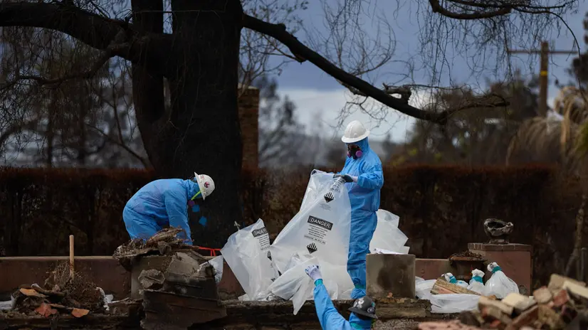 epa11962711 An environmental team clears asbestos debris from a home that burned down during the Eaton wildfire as recovery efforts continue in Altadena, California, USA, 13 March 2025. Los Angeles County, the city of Pasadena, and the city of Sierra Madre have all filed lawsuits against Southern California Edison for damages from the Eaton Fire. The lawsuits allege the utility company's equipment caused the fire. EPA/ALLISON DINNER