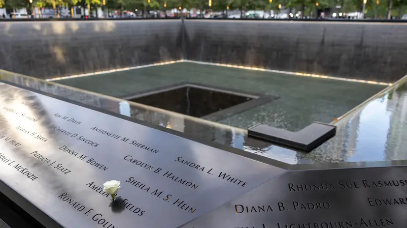 epa11598304 A flower is seen placed in one of the 9/11 Memorial Pools before the 23rd 9/11 commemoration ceremony at the 9/11 Memorial and Museum in New York, New York, USA, 11 September 2024. EPA/SARAH YENESEL