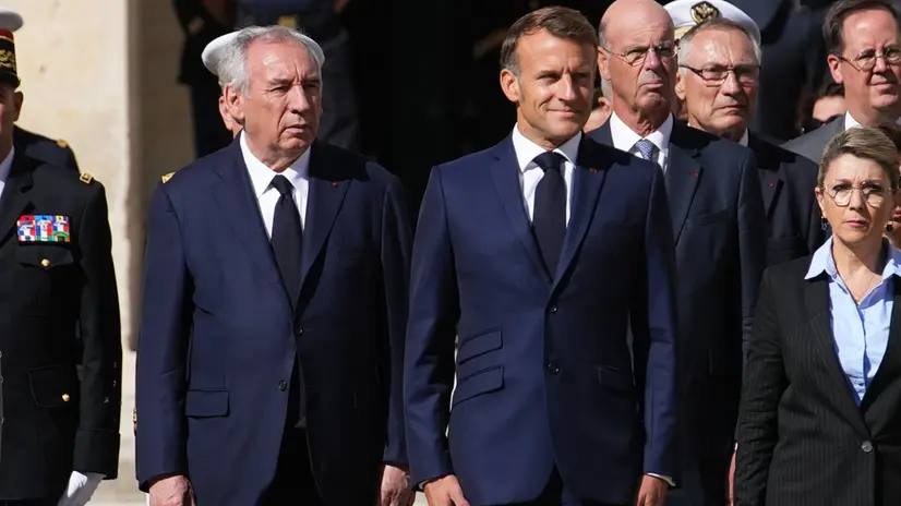 epa12354057 French President Emmanuel Macron (C) and Prime Minister Francois Bayrou (L) attend a farewell ceremony for Chief of Staff of the French Armed Forces General Thierry Burkhard, in the courtyard of the Invalides, in Paris, France, 05 September 2025. EPA/CHRISTOPHE ENA / POOL MAXPPP OUT