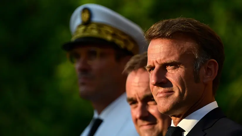 epa12307060 France's President Emmanuel Macron (R) and France's Minister of Armed Forces Sebastien Lecornu (C) look on during a ceremony marking the 81st anniversary of the liberation of Bormes-les-Mimosas during World War II, southeastern France, 17 August 2025. EPA/MIGUEL MEDINA / POOL MAXPPP OUT
