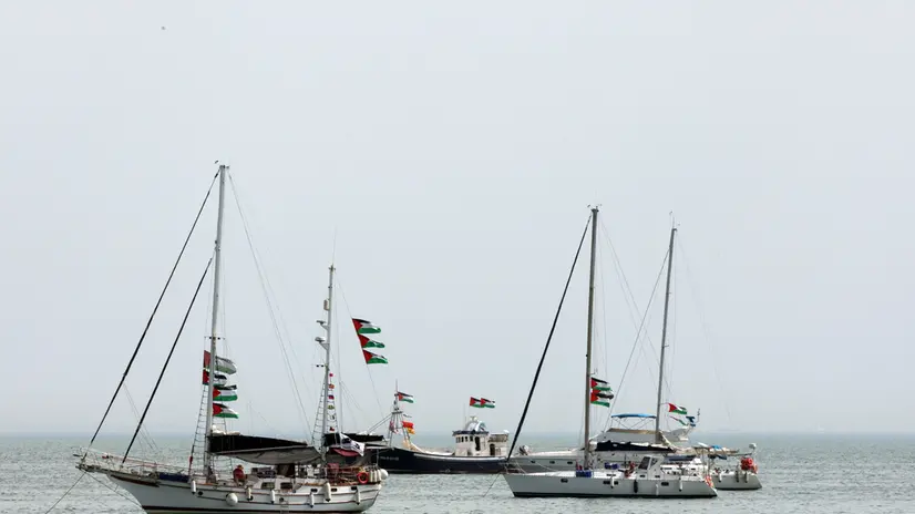 epa12364799 Vessels, part of the Global Sumud Flotilla, off the coast of Sidi Bou Said, one day after a drone attack on one of the humanitarian ships in Tunisian waters off Tunis, Tunisia, 09 September 2025. The Global Sumud Flotilla (GSF) for Gaza announced on 09 September that one of its main vessels was reportedly targeted by a drone while in Tunisian waters. The six people on board, both passengers and crew, were not injured. According to the WFTU statement, the ship, which sails under the Portuguese flag and carries the initiative's steering committee, suffered damage following a fire affecting the main deck and a storage area. Tunisian authorities rejected the theory of an airstrike, saying that, according to a first inspection, the explosion that caused the fire probably started inside the ship. EPA/MOHAMED MESSARA
