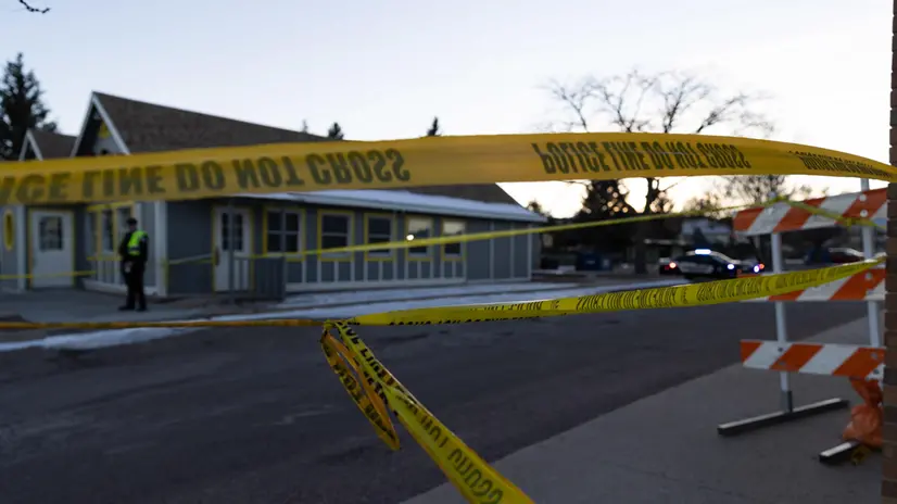 epa10319251 Police tape blocks off the area surrounding the LGBTQ nightclub Club Q, in Colorado Springs, Colorado, USA, 21 November 2022. According to police, at least five people were killed and 25 people were wounded during a mass shooting inside the nightclub on Saturday night. EPA/LIZ COPAN
