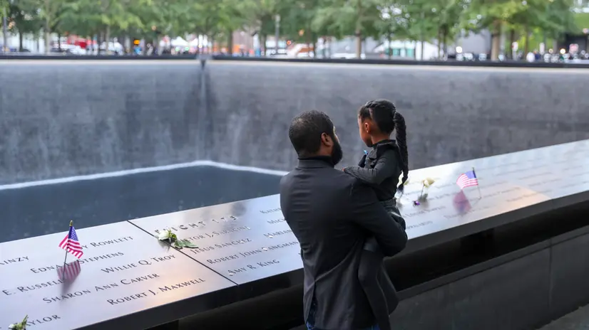 epa12369183 People observe the South Tower Pool during the 24th anniversary 9/11 Commemoration Ceremony at the 9/11 Memorial in New York, New York, USA, 11 September 2025. EPA/SARAH YENESEL
