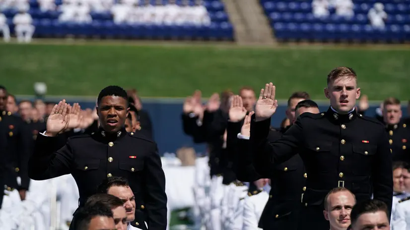 epa09233406 United States Navy Midshipmen take their oath following US Vice President Kamala Harris delivering the keynote address for the United States Naval Academy Class of 2021 graduation and commissioning ceremony held at Navy-Marine Corps Memorial Stadium in Annapolis, Maryland, USA, 28 May 2021. EPA/Alex Edelman / POOL