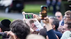 epa12370242 People film US President Donald Trump speaking to reporters about the murder of Turning Point founder Charlie Kirk as he leaves the White House for New York City in Washington, DC, USA, 11 September 2025. Trump said law enforcement was making ‘big progress’ towards finding the killer. EPA/JIM LO SCALZO