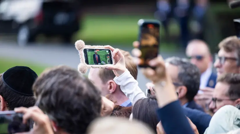 epa12370242 People film US President Donald Trump speaking to reporters about the murder of Turning Point founder Charlie Kirk as he leaves the White House for New York City in Washington, DC, USA, 11 September 2025. Trump said law enforcement was making ‘big progress’ towards finding the killer. EPA/JIM LO SCALZO
