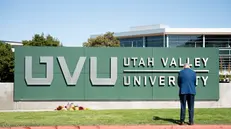 epa12370205 A man prays, the day after Charlie Kirk, CEO and co-founder of the conservative youth organization Turning Point USA, was shot dead, at Utah Valley University in Orem, Utah, USA, 11 September 2025.. Kirk was shot dead on 10 September at an event he was hosting at Utah Valley University. EPA/MARIELLE SCOTT