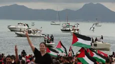 epaselect epa12367944 Pro-Palestinian demonstrators attend a rally in support of the Global Sumud Flotilla at the port of Sidi Bou Said, Tunisia, 10 September 2025. The Global Sumud Flotilla (GSF) will depart from Tunis to Gaza on 10 September as part of a humanitarian effort. GSF is an international maritime initiative, launched and led by non-governmental organizations, aiming to break the Israeli blockade of the Gaza Strip and deliver vital aid. EPA/MOHAMED MESSARA