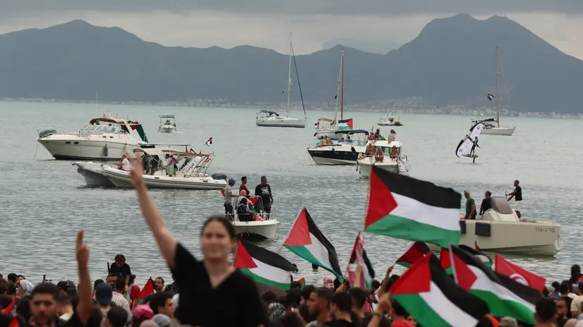 epaselect epa12367944 Pro-Palestinian demonstrators attend a rally in support of the Global Sumud Flotilla at the port of Sidi Bou Said, Tunisia, 10 September 2025. The Global Sumud Flotilla (GSF) will depart from Tunis to Gaza on 10 September as part of a humanitarian effort. GSF is an international maritime initiative, launched and led by non-governmental organizations, aiming to break the Israeli blockade of the Gaza Strip and deliver vital aid. EPA/MOHAMED MESSARA