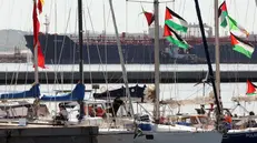 epa12372807 Participants of the Global Sumud Flotilla (GSF) wait to set sail towards Gaza along with other boats at the port of Bizerte, Tunisia, 13 September 2025. The Gaza-bound GSF flotilla is an international maritime initiative that began sailing in August 2025, aiming to break the Israeli blockade and deliver vital aid to the Gaza Strip. EPA/MOHAMED MESSARA