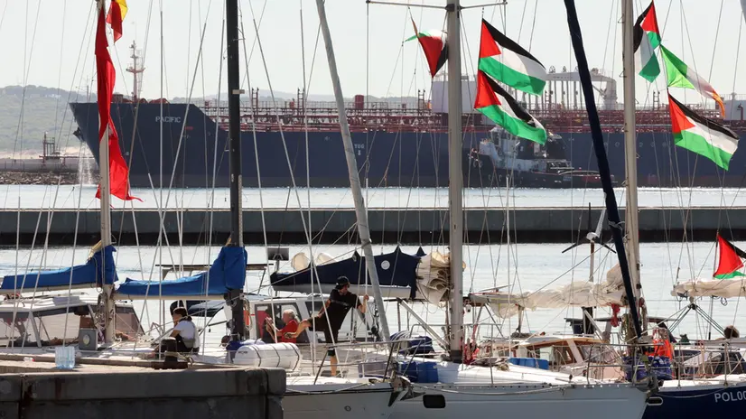 epa12372807 Participants of the Global Sumud Flotilla (GSF) wait to set sail towards Gaza along with other boats at the port of Bizerte, Tunisia, 13 September 2025. The Gaza-bound GSF flotilla is an international maritime initiative that began sailing in August 2025, aiming to break the Israeli blockade and deliver vital aid to the Gaza Strip. EPA/MOHAMED MESSARA