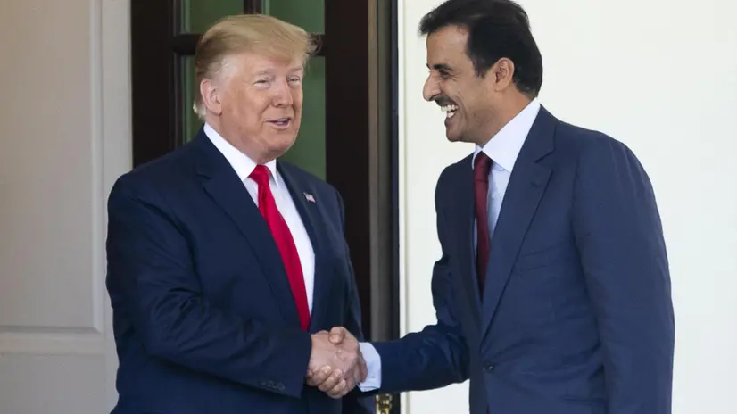 epa07705940 US President Donald J. Trump (L) shakes hands with Amir of the State of Qatar Sheikh Tamim bin Hamad Al Thani (R), upon the Amir's arrival outside the West Wing of the White House in Washington, DC, USA, 09 July 2019. The two leaders meet during heightened tensions between the US and Iran. EPA/MICHAEL REYNOLDS
