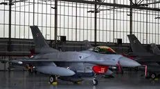 epa12369028 A Polish Air Force F-16 fighter jet is stationed at the 31st Tactical Air Base during a visit by Polish President Karol Naworcki (not pictured), Poznan - Krzesiny, Poland, 11 September 2025. The president's urgent visit to the Air base in Krzesiny is related to the violation of airspace by Russian drones. EPA/JAKUB KARCZMARCZYK POLAND OUT