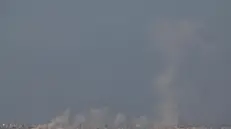 epa12381496 Smoke rises after an Israeli airstrike on the outskirts of Gaza City, as seen from an undisclosed location on the Israeli side of the border, 16 September 2025. More than 64,900 Palestinians have been killed in the Gaza Strip since October 2023, according to the Palestinian Ministry of Health. EPA/ATEF SAFADI