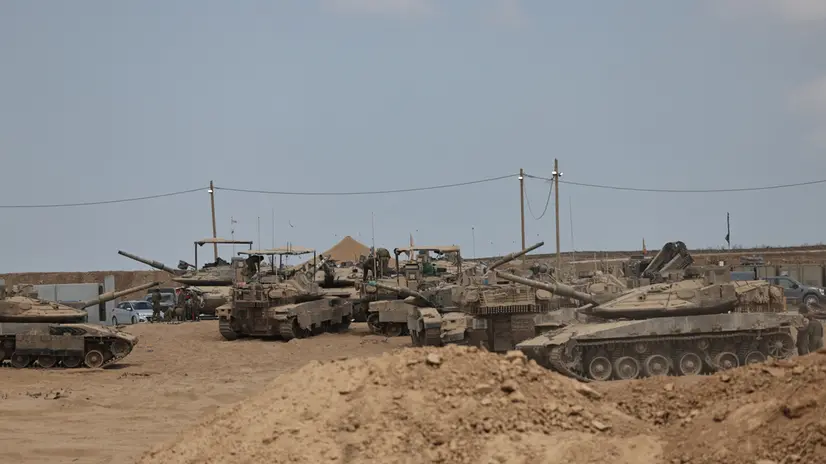 epa12381712 Israeli tanks and armoured vehicles are deployed along the Israel-Gaza border in southern Israel, 16 September 2025. Israeli Prime Minister Benjamin Netanyahu confirmed during a court appearance that the Israeli military has begun a major operation in Gaza City. More than 64,800 people have been killed in the Gaza Strip since October 2023, according to the Palestinian Ministry of Health. EPA/ATEF SAFADI